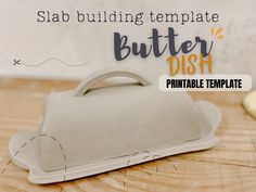 this is an image of a butter dish on a wooden table with the words, slab building template