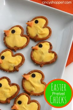 decorated cookies with yellow icing in the shape of ducks