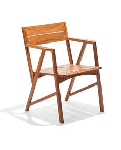 a wooden chair sitting on top of a white floor