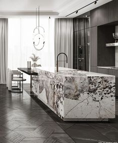 an elegant kitchen with marble counter tops