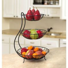 three tiered metal fruit bowl stand with apples, oranges and pears