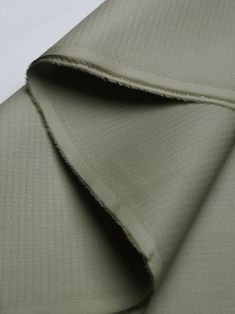 the fabric is very soft and light green with some folds on it's sides