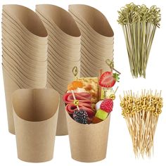 there are many different types of food in the cups and straws on the table