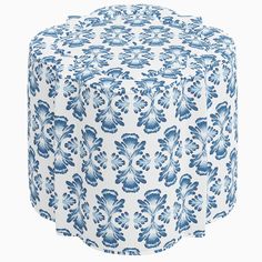 a blue and white floral print ottoman cover