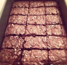 a box filled with brownies sitting on top of a counter