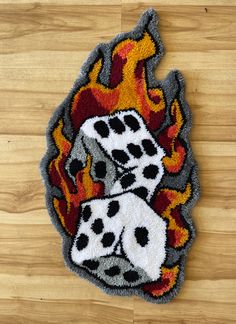 a pair of dices with flames on the floor