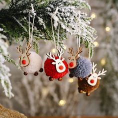 three christmas ornaments hanging from a tree