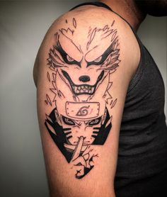 a man with a tattoo on his arm that has an image of a demon in it