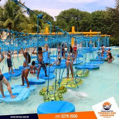 people are playing in the water at an amusement park