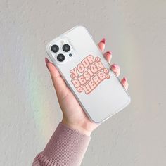 a woman holding up her phone case with the words your design here on it in pink