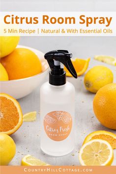 citrus room spray with oranges and lemons in the background