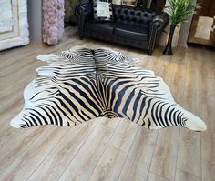 a zebra print rug on the floor in a living room