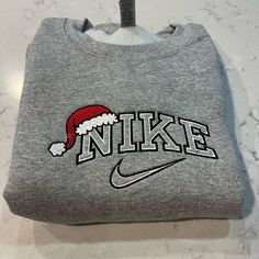 Not Nike Brand Please Allow Up To A Week To Ship Design Size Is 7x5 -Unisex Sizing True To Fit -Embroidered Design -Use Gildan Brand For Crewnecks, However There May Be A Substitute For A Similar Brand -Available In S, M, L, Xl, 2xl Size Of Design Is The Same For All Sizes Of Crewnecks So Design Will Look Smaller On A 2xl Compared To A S Material Is 50/50 Cotton/Polyester *Colors May Vary Slightly* Embroidery Crewneck Ideas, Christmas Nike Sweatshirt, Customized Nike Crewnecks, Nike Christmas Sweatshirt, Christmas Crewneck Nike, Custom Nike Sweatshirt, Custom Nike Hoodie, Christmas Embroidery Sweatshirts Nike, Red Nike Embroidered Crewneck For Sale