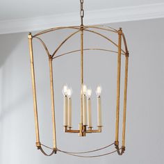 a chandelier with five candles hanging from it