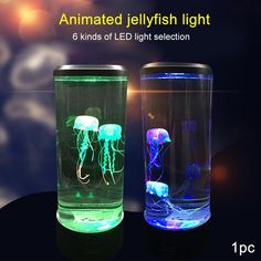 two glass vases that have jellyfish in them