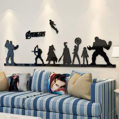 a living room filled with furniture and silhouettes of people on the wall above them