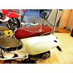 a motor scooter is parked in a garage