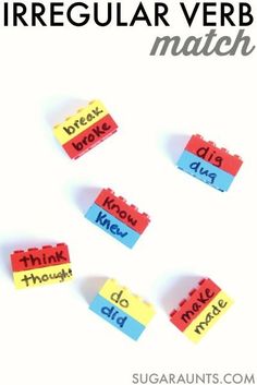 four pieces of colored paper with words that spell irregular verbs on them, and the word