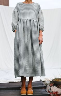 • Handmade in our studio • Loose fit, higher waistline • Rouleau loop and button fastening at the back • Hand ruffled skirt • 3/4 length puff sleeves with dropped shoulders • Side seam pockets • Available from XXS to XXL size or can be made in a custom size Couture, Midlife Fashion, Gingham Linen, Modest Dresses Casual, Full Length Dress, Stylish Dress Designs, Puffy Sleeves, Modest Dresses