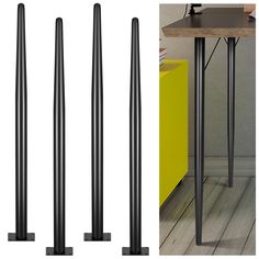 three black metal poles sitting on top of a wooden floor next to a yellow box