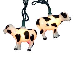 two black and white cow lights on a string