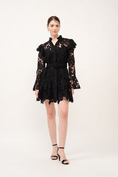 Step into timeless beauty with the Noir Lace Butterfly Sleeve Mini Dress. Designed with an intricate floral lace pattern, this dress features a high collar and butterfly sleeves for a touch of Victorian elegance. The ruffle shoulders and long sleeves with ruffle cuffs add to its romantic appeal, while the front buttons and self-tie belt provide a customizable fit. Perfect for weddings, garden parties, and any event where sophistication meets grace. Ruffle shoulders Front buttons for easy closure Butterfly Lace Dress, Victorian Elegance, Floral Lace Pattern, Lace Butterfly, Mini Dress Blue, Defined Waist, Butterfly Sleeve, Classic Heels, Butterfly Dress