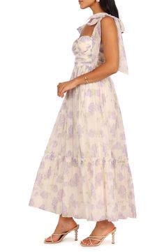 Get your garden-party season RSVPs out; you've found the perfect dress to make you the belle of the blooms. Exposed back-zip closure Sweetheart neck Adjustable tie straps Lined 100% polyester Hand wash, dry flat Imported Garden Dress Party, Bow Tie Strap Dress, Floral Lavender Dress, Feminine Lavender Dress With Sweetheart Neckline, Purple Floral Dress For Spring Garden Party, Fitted Lavender Midi Dress For Garden Party, Lavender Spring Dress With Sweetheart Neckline, Summer Lavender Dress With Fitted Bodice, Summer Lavender Dresses With Fitted Bodice