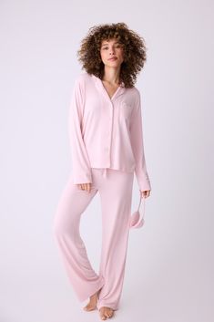 Elevate your sleepwear with purpose in our Women's classic pajama set in pink modal, created in partnership with the Susan G. Komen Foundation. This set boasts ivory piping, a button-front collared top, and straight-leg tie-waist pant, complemented by an embroidered eye mask with 'LOVE'. For 2024-2025, P.J. Salvage proudly pledges a $50,000 donation to Susan G. Komen. Susan G Komen, Classic Pajamas, Tie Waist Pants, Collared Top, Button Front Top, Collar Top, Pj Sets, Piping, Eye Mask