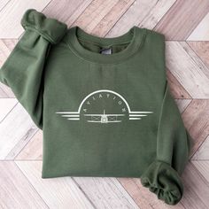 Funny Airplane Sweatshirt, Aviation Shirt, Gift for Pilot, Aviator Shirt, Airplane T-shirt, Shirt for Pilot, Funny Pilot Shirt, Pilot Gift ABOUT: :) This pre-shrunk, classic fit sweatshirt is made with air-jet spun yarn for a soft feel and reduced pilling. :) Pre-shrunk :) Classic fit with no center crease :) 1x1 athletic rib knit collar with spandex :) Air-jet spun yarn with a soft feel and reduced pilling :) Double-needle stitched collar, shoulders, armholes, cuffs, and hem: 50% preshrunk cott Airplane Humor, Funny Pilot, Pilot Shirt, Photo Care, Pilot Gifts, Workout Sweatshirt, Deep Colors, Air Jet, Knit Collar