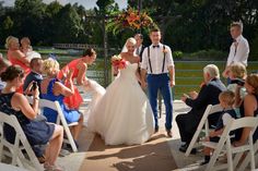 the bride and groom are walking down the aisle