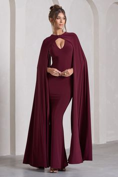 Opt for opulence at your next black tie event in Standing Ovation. This enchanting burgundy maxi dress was designed in our signature stretch jersey that hugs each curve and effortlessly accentuates your frame. Defined by extravagant cape sleeves. keep Standing Ovation at the forefront by styling it with a tousled bun and strappy stilettos. Features - Premium stretch jersey - Plunge neckline- Cape sleeves- Knot detail - Open back- Invisible zip closure - Fishtail skirt- Maxi length Sizing & Fit M Midi Bridesmaid Dress, Burgundy Maxi Dress, Standing Ovation, Little Red Dress, Black Dress Prom, Fishtail Skirt, Black Tie Gala, Strappy Stilettos, Party Dress Long Sleeve