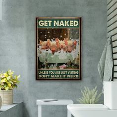 a bathroom with a sink, toilet and poster on the wall that says get naked unless you are just using don't make it weird