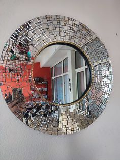 a mirror that is on the side of a wall