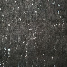 an abstract black and white painting with lots of small dots on the surface that looks like snow