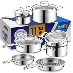 an assortment of stainless steel pots and pans in front of a box on a white background