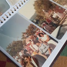 several polaroid photos are placed on top of a notebook