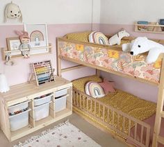 a child's bedroom with bunk beds and toys