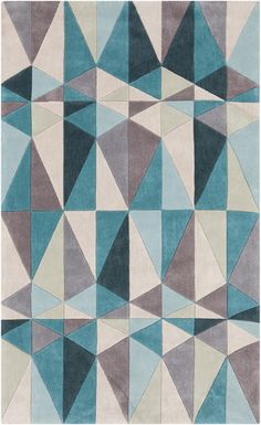 an area rug with blue, grey and white geometric shapes on it's sides