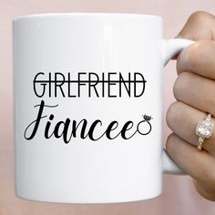 a woman's hand holding a coffee mug with the words girlfriend frances on it