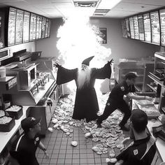 two men are in a fast food restaurant and one man is wearing a wizard costume