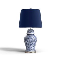 a blue and white table lamp with a blue shade on the top, against a white background