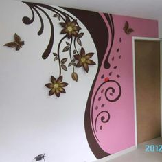 the wall is painted pink and brown with flowers on it's side, along with butterflies