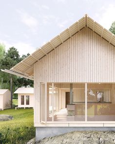 a small house sitting on top of a lush green field