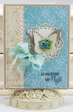 a blue and white card with a butterfly on it's side that says let your dreams take flight