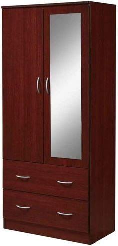 a wooden armoire with mirrored doors and drawers