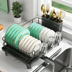 a dish rack filled with dishes next to a sink