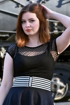 Model wearing outfit with 3" wide striped elastic waist belt with flat metal buckle and 1/4" wide black and white horizontal stripes Edgy Fitted Black Belt, Edgy Black Fitted Belt, Black Fitted Casual Belt, Casual Black Belt For Summer, Micro Miniskirt, Lace Up Leggings, Tank Top Skirt, Lace Trim Shorts, Sheer Skirt