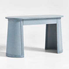 a small blue table sitting on top of a white floor