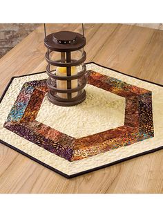 a lantern is sitting on top of a rug