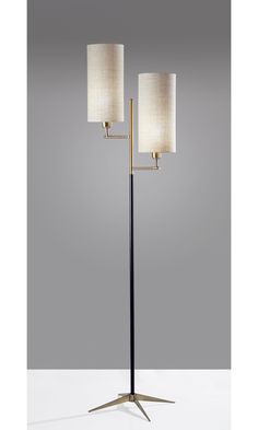 a floor lamp with two lamps on it